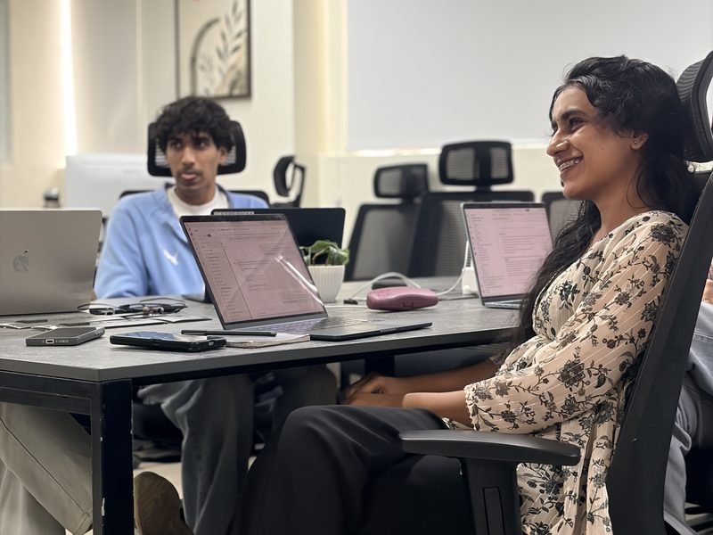 Two engineers at their desks in the Kochi office