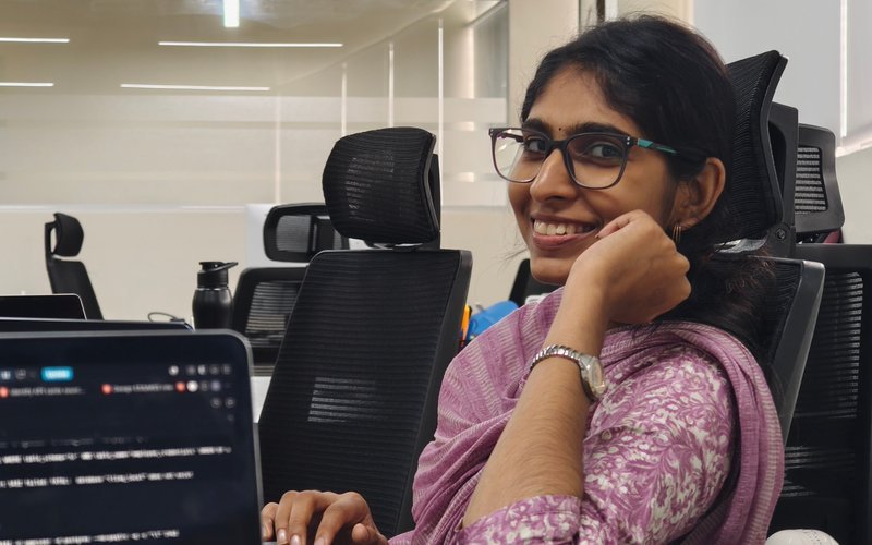 An Expericia engineer at her desk at the Kochi office, reviewing code on screen