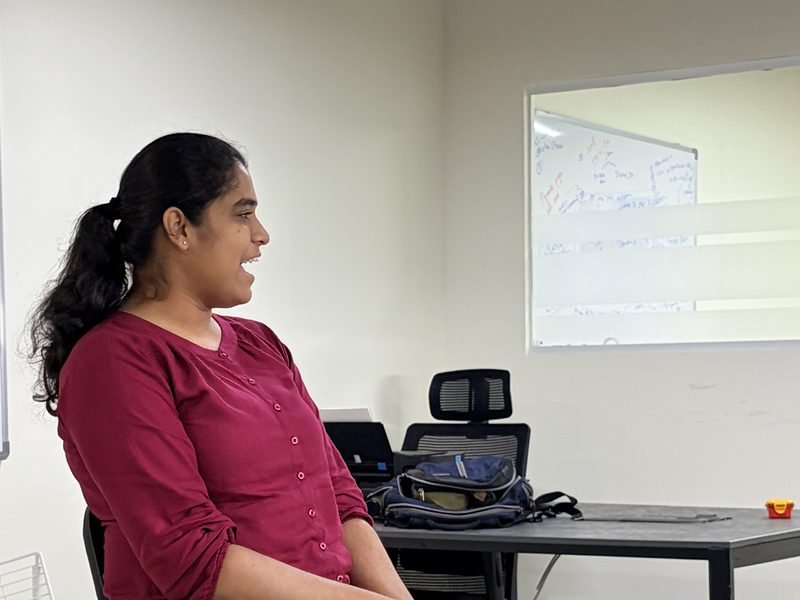 A discovery workshop at the Kochi office: an analyst talking a requirement through in front of the board