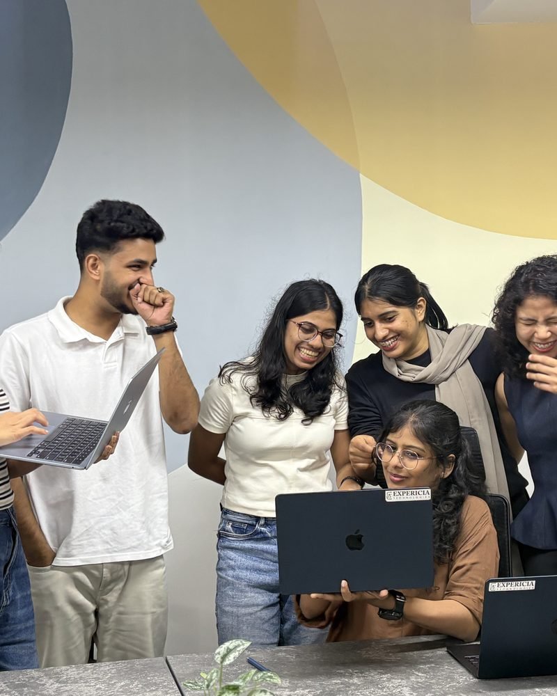 The team gathered around one laptop at go-live