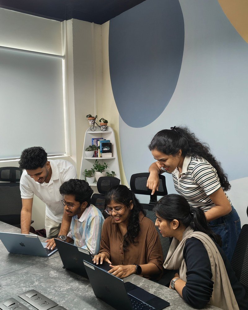 The Expericia team reviewing a build together at the Kochi office