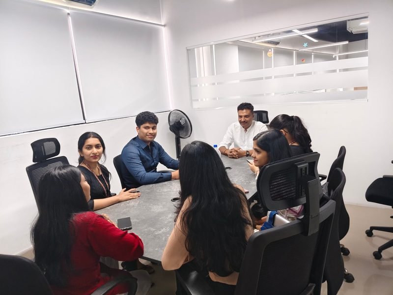 Karthick and the team reviewing a project in the Kochi meeting room